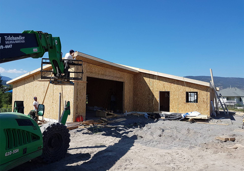 man working on wooden roof