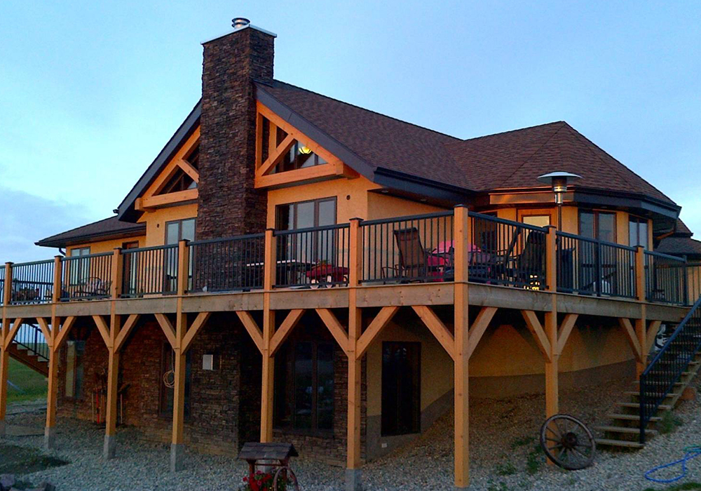 Completed timberframe log home with SIPs panels