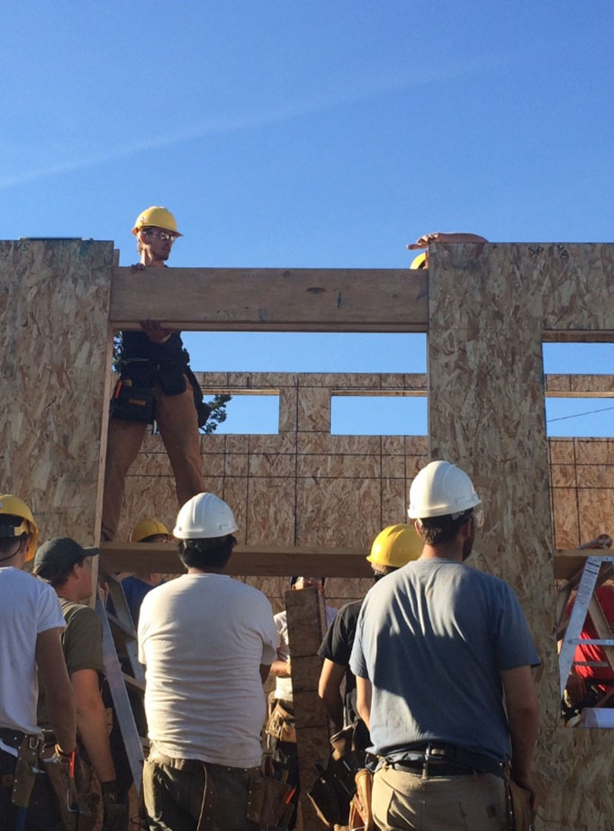 workers building house
