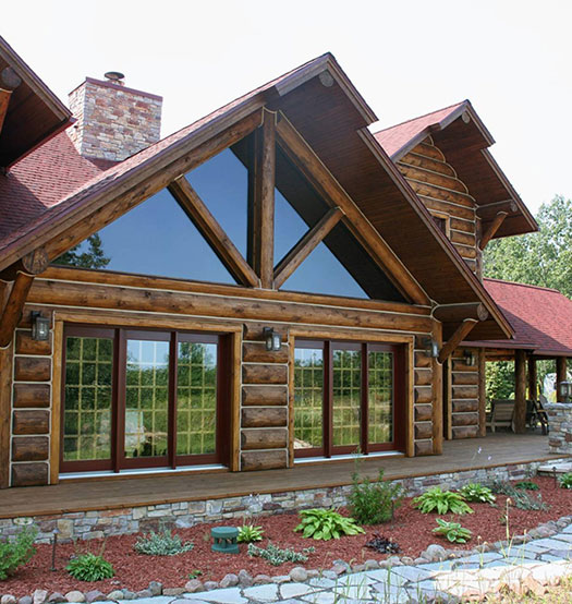 SIP panels on a log cabin