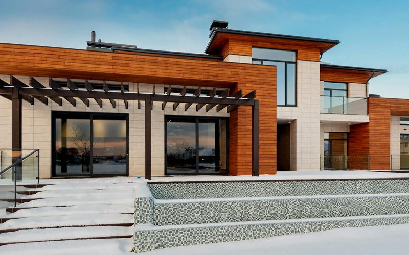 Exterior image of modern home with wood and stone exterior